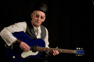 Kevin Weatherill with blue guitar